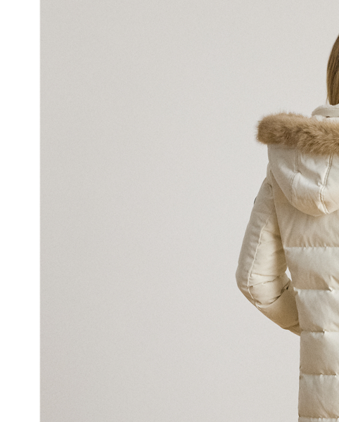 Equal parts stylish and practical, this channel-quilted coat is designed with a detachable, faux fur-trimmed hood, a water-resistant shell and cosy 450-fill-power down to keep you dry and warm. Front and back princess seams enhance this style’s streamlined silhouette, while “LRL”-engraved metal snaps add signature style.