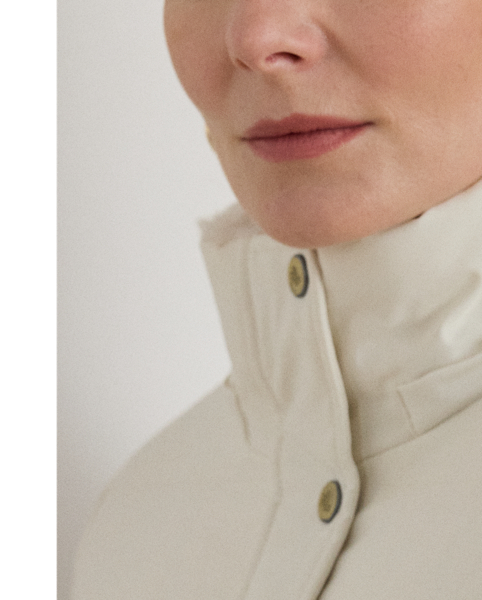 Equal parts stylish and practical, this channel-quilted coat is designed with a detachable, faux fur-trimmed hood, a water-resistant shell and cosy 450-fill-power down to keep you dry and warm. Front and back princess seams enhance this style’s streamlined silhouette, while “LRL”-engraved metal snaps add signature style.