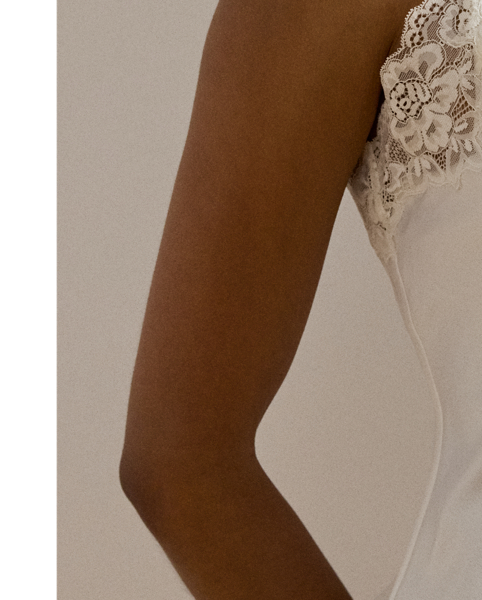 The luxuriously smooth hand of satin lends a lustrous sheen to this sleep set, which pairs airy shorts with a double-strap camisole. Delicate lace trim enhances its romantic appeal.