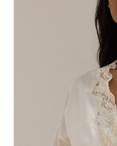 The luxuriously smooth hand of satin lends a subtle sheen to this robe, while delicate lace trim enhances its romantic allure. A self-belt on the waist creates a defined silhouette.