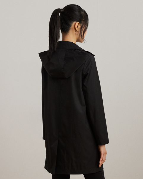 With a water-repellent cotton-blend shell and a menswear-inspired balmacaan coat silhouette, this piece seamlessly merges practical design elements with sophisticated sartorial details. A detachable hood offers versatility, while "Lauren Ralph Lauren Lauren"-engraved horn-effect buttons add a signature finish.