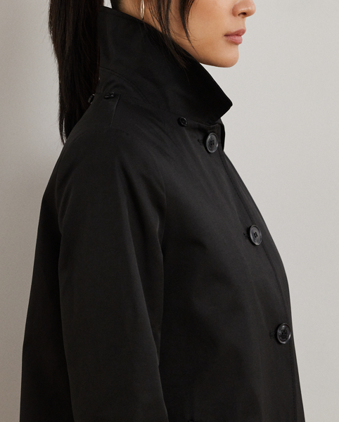 With a water-repellent cotton-blend shell and a menswear-inspired balmacaan coat silhouette, this piece seamlessly merges practical design elements with sophisticated sartorial details. A detachable hood offers versatility, while "Lauren Ralph Lauren Lauren"-engraved horn-effect buttons add a signature finish.
