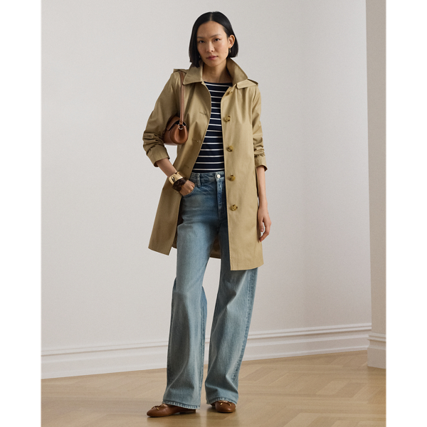 With a water-repellent cotton-blend shell and a menswear-inspired balmacaan coat silhouette, this piece seamlessly merges practical design elements with sophisticated sartorial details. A detachable hood offers versatility, while "Lauren Ralph Lauren Lauren"-engraved horn-effect buttons add a signature finish.