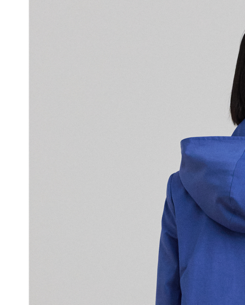 With a water-repellent cotton-blend shell and a menswear-inspired balmacaan coat silhouette, this piece seamlessly merges practical design elements with sophisticated sartorial details. A detachable hood offers versatility, while "Lauren  Ralph Lauren Lauren"-engraved horn-effect buttons add a signature finish.