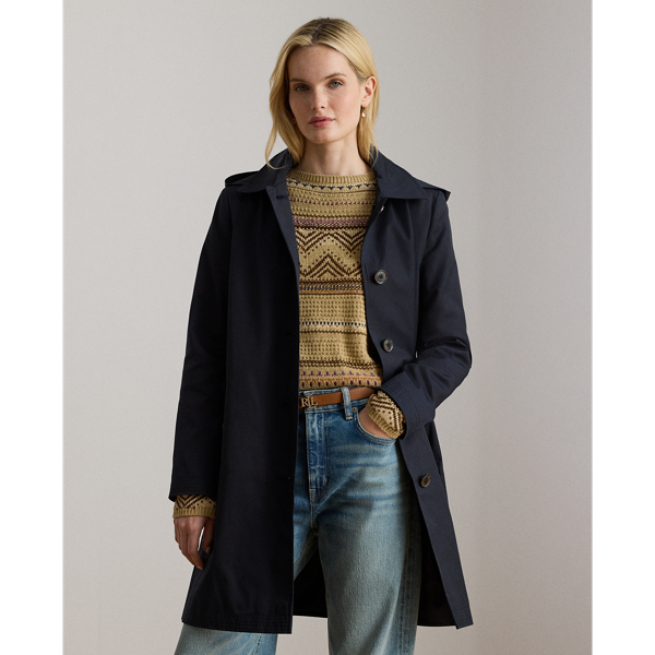 With a water-repellent cotton-blend shell and a menswear-inspired balmacaan coat silhouette, this piece seamlessly merges practical design elements with sophisticated sartorial details. A detachable hood offers versatility, while "Lauren Ralph Lauren Lauren"-engraved horn-effect buttons add a signature finish.