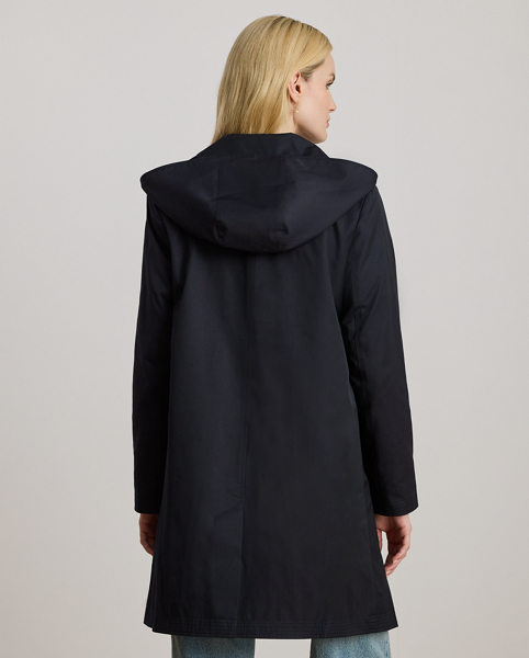 With a water-repellent cotton-blend shell and a menswear-inspired balmacaan coat silhouette, this piece seamlessly merges practical design elements with sophisticated sartorial details. A detachable hood offers versatility, while "Lauren Ralph Lauren Lauren"-engraved horn-effect buttons add a signature finish.
