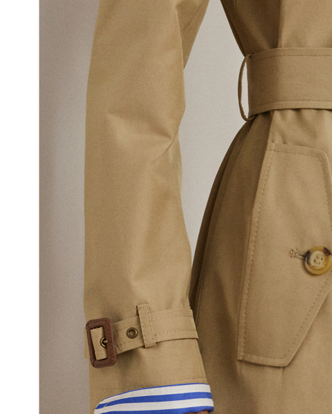 Rendered in a soft cotton blend, Lauren's take on the trench coat showcases traditional styling details, including a double-breasted silhouette and buttoned shoulder epaulets. A buckled self-belt accentuates the waist, while "Lauren  Ralph Lauren Lauren"-engraved horn-effect buttons lend a signature finish.