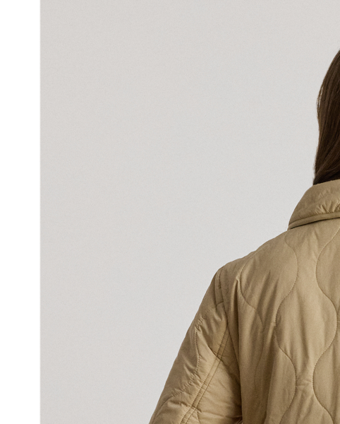 With its insulated, onion-quilted silhouette and spread collar, this jacket is both a practical and sophisticated addition to your outerwear collection. "Lauren  Ralph Lauren Lauren"-engraved horn-effect buttons complete the look.