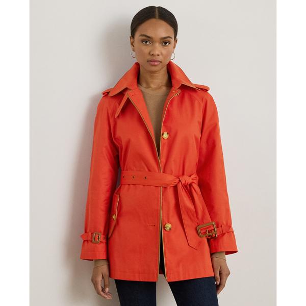 Classic trench styling meets luxurious faux-leather trim in this cotton-blend trench coat. A belted waist, buttoned shoulder epaulets and signature horn-effect buttons complete the look.