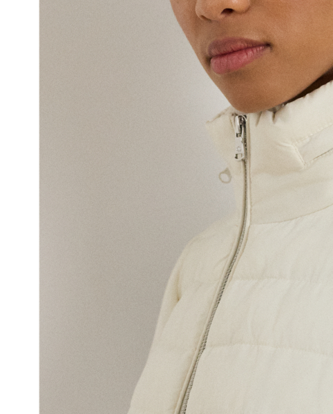 Designed with a stowaway hood that tucks into its funnelneck, this versatile puffer jacket features an insulated channel-quilted construction and a drawcord waist for the perfect cosy fit.