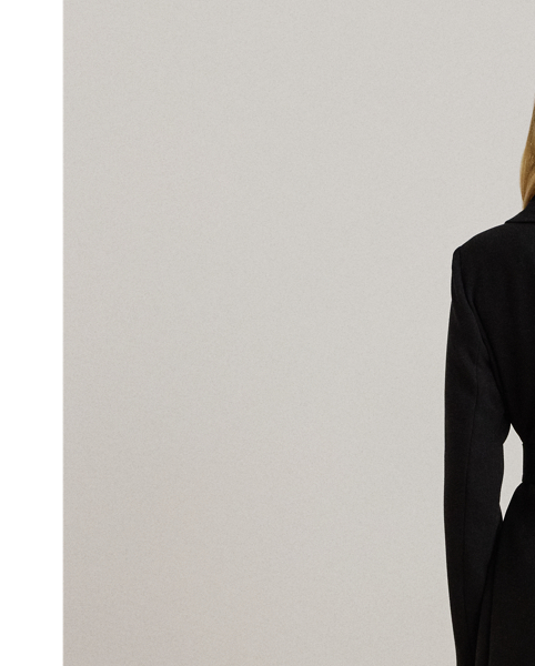 An oversize collar and belted waist enhance the elegant appeal of this crepe wrap coat.