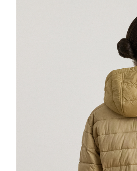 Designed with a drawcord hood and an insulated silhouette to keep you warm, this style features a channel-quilted puffer shell layered over a vestee. A tonal embroidered monogram at the chest and "LRL"-engraved snaps add unmistakable Lauren  Ralph Lauren Lauren style.