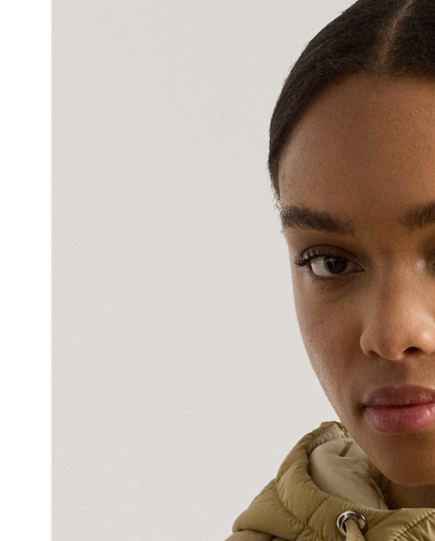 Designed with a drawcord hood and an insulated silhouette to keep you warm, this style features a channel-quilted puffer shell layered over a vestee. A tonal embroidered monogram at the chest and "LRL"-engraved snaps add unmistakable Lauren  Ralph Lauren Lauren style.