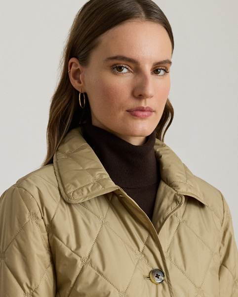 A refined layering piece, this coat features a long, streamlined silhouette distinguished by an allover "LRL"-embroidered motif and diamond quilting. Its 500-fill-power down offers an ultracosy feel, while "Lauren Ralph Lauren Lauren"-engraved horn-effect buttons add signature style.