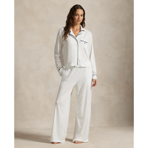 Crafted from a soft cotton blend, this pyjama set comes with a long-sleeved buttoned shirt and full-length trousers. Contrast piped trim and  Ralph Lauren Lauren's signature embroidered Pony complete this classic look.