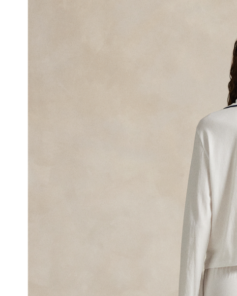 Crafted from a soft cotton blend, this pyjama set comes with a long-sleeved buttoned shirt and full-length trousers. Contrast piped trim and  Ralph Lauren Lauren's signature embroidered Pony complete this classic look.