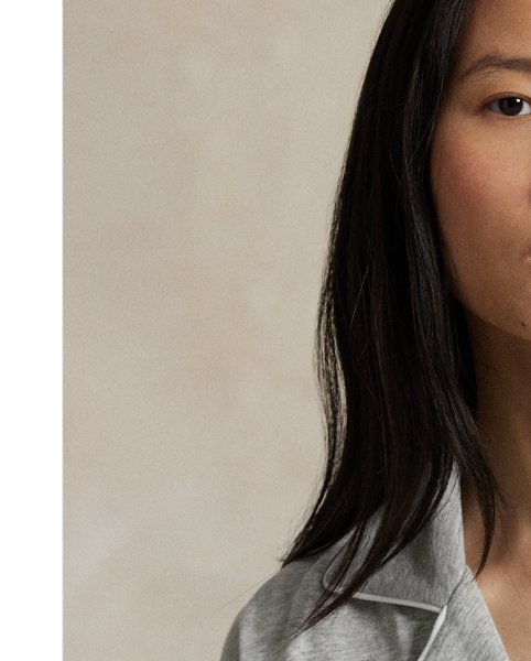 Crafted from a soft cotton blend, this pyjama set comes with a long-sleeved buttoned shirt and full-length trousers. Contrast piped trim and  Ralph Lauren Lauren's signature embroidered Pony complete this classic look.