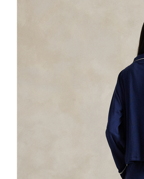 Crafted from a soft cotton blend, this pyjama set comes with a long-sleeved buttoned shirt and full-length trousers. Contrast piped trim and  Ralph Lauren Lauren's signature embroidered Pony complete this classic look.