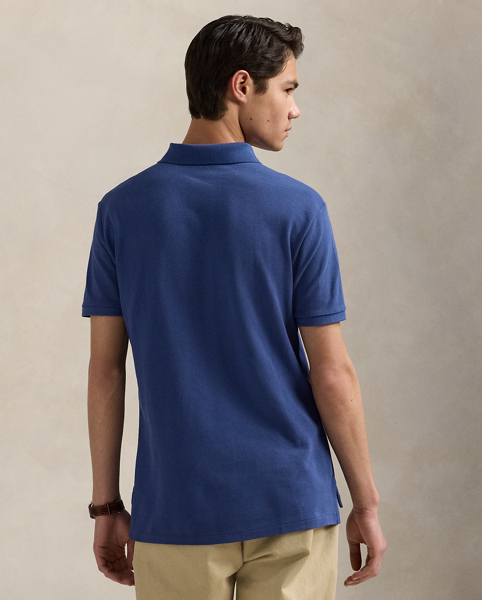 An American style standard since 1972, the Polo shirt has been imitated but never matched. Over the decades, Ralph Lauren Lauren has re-imagined his signature style in a wide array of colours and fits, yet all retain the quality and attention to detail of the iconic original. This Classic Fit version is made from our highly breathable cotton mesh, which offers a textured look and a soft feel.
