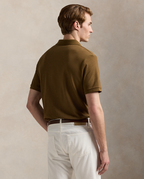 An American style standard since 1972, the Polo shirt has been imitated but never matched. Over the decades, Ralph Lauren Lauren has re-imagined his signature style in a wide array of colours and fits, yet all retain the quality and attention to detail of the iconic original. This Classic Fit version is made from our highly breathable cotton mesh, which offers a textured look and a soft feel.