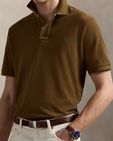 An American style standard since 1972, the Polo shirt has been imitated but never matched. Over the decades, Ralph Lauren Lauren has re-imagined his signature style in a wide array of colours and fits, yet all retain the quality and attention to detail of the iconic original. This Classic Fit version is made from our highly breathable cotton mesh, which offers a textured look and a soft feel.
