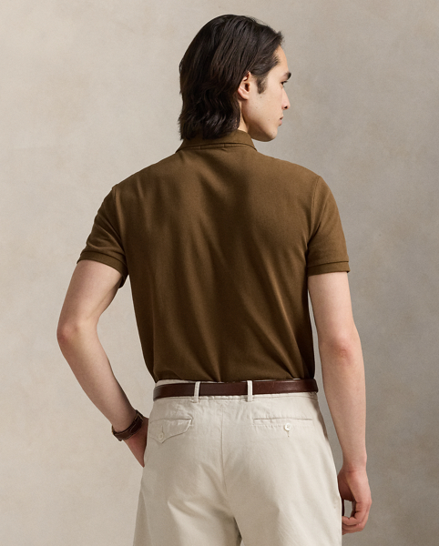 An American style standard since 1972, the Polo shirt has been imitated but never matched. Over the decades, Ralph Lauren Lauren has re-imagined his signature style in a wide array of colours and fits, yet all retain the quality and attention to detail of the iconic original. This version is made from our highly breathable cotton mesh, which offers a textured look and a soft feel.