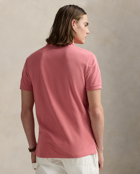 An American style standard since 1972, the Polo shirt has been imitated but never matched. Over the decades, Ralph Lauren Lauren has re-imagined his signature style in a wide array of colours and fits, yet all retain the quality and attention to detail of the iconic original. This version is made from our highly breathable cotton mesh, which offers a textured look and a soft feel.