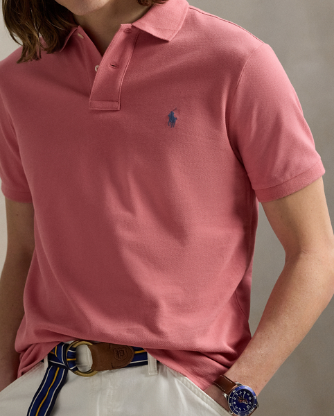 An American style standard since 1972, the Polo shirt has been imitated but never matched. Over the decades, Ralph Lauren Lauren has re-imagined his signature style in a wide array of colours and fits, yet all retain the quality and attention to detail of the iconic original. This version is made from our highly breathable cotton mesh, which offers a textured look and a soft feel.