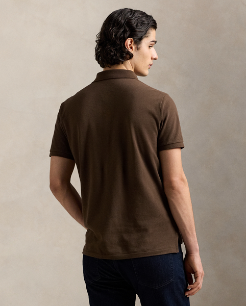 An American style standard since 1972, the Polo shirt has been imitated but never matched. Over the decades, Ralph Lauren Lauren has re-imagined his signature style in a wide array of colours and fits, yet all retain the quality and attention to detail of the iconic original. This version is made from our highly breathable cotton mesh, which offers a textured look and a soft feel.