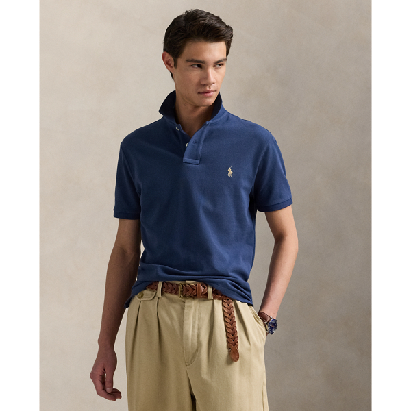 An American style standard since 1972, the Polo shirt has been imitated but never matched. Over the decades, Ralph Lauren Lauren has re-imagined his signature style in a wide array of colours and fits, yet all retain the quality and attention to detail of the iconic original. This trim version is made from our highly breathable cotton mesh, which offers a textured look and a soft feel.