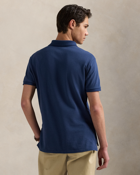 An American style standard since 1972, the Polo shirt has been imitated but never matched. Over the decades, Ralph Lauren Lauren has re-imagined his signature style in a wide array of colours and fits, yet all retain the quality and attention to detail of the iconic original. This trim version is made from our highly breathable cotton mesh, which offers a textured look and a soft feel.