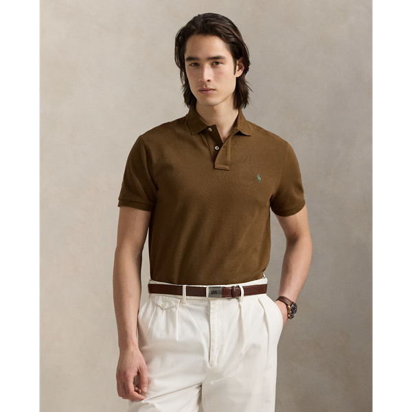 An American style standard since 1972, the Polo shirt has been imitated but never matched. Over the decades, Ralph Lauren Lauren has re-imagined his signature style in a wide array of colours and fits, yet all retain the quality and attention to detail of the iconic original. This trim version is made from our highly breathable cotton mesh, which offers a textured look and a soft feel.