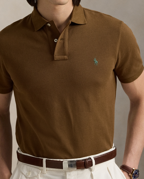 An American style standard since 1972, the Polo shirt has been imitated but never matched. Over the decades, Ralph Lauren Lauren has re-imagined his signature style in a wide array of colours and fits, yet all retain the quality and attention to detail of the iconic original. This trim version is made from our highly breathable cotton mesh, which offers a textured look and a soft feel.