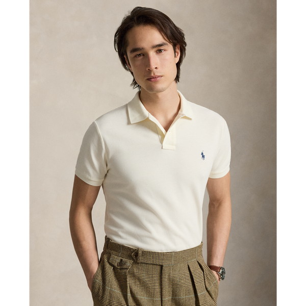 An American style standard since 1972, the Polo shirt has been imitated but never matched. Over the decades,  Ralph Lauren Lauren has re-imagined his signature style in a wide array of colours and fits, yet all retain the quality and attention to detail of the iconic original. This trim version is made from our highly breathable cotton mesh, which offers a textured look and a soft feel.