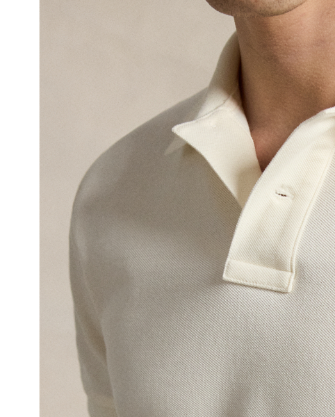 An American style standard since 1972, the Polo shirt has been imitated but never matched. Over the decades,  Ralph Lauren Lauren has re-imagined his signature style in a wide array of colours and fits, yet all retain the quality and attention to detail of the iconic original. This trim version is made from our highly breathable cotton mesh, which offers a textured look and a soft feel.