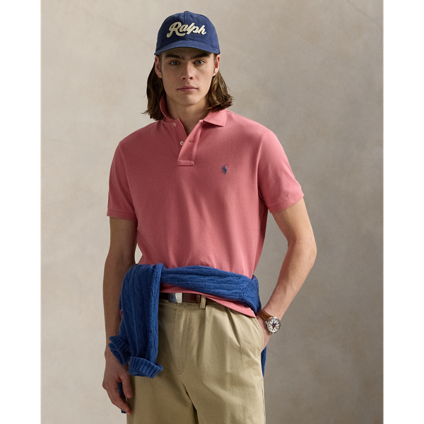 An American style standard since 1972, the Polo shirt has been imitated but never matched. Over the decades, Ralph Lauren Lauren has re-imagined his signature style in a wide array of colours and fits, yet all retain the quality and attention to detail of the iconic original. This trim version is made from our highly breathable cotton mesh, which offers a textured look and a soft feel.