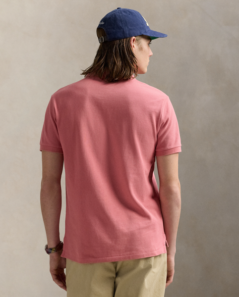 An American style standard since 1972, the Polo shirt has been imitated but never matched. Over the decades, Ralph Lauren Lauren has re-imagined his signature style in a wide array of colours and fits, yet all retain the quality and attention to detail of the iconic original. This trim version is made from our highly breathable cotton mesh, which offers a textured look and a soft feel.