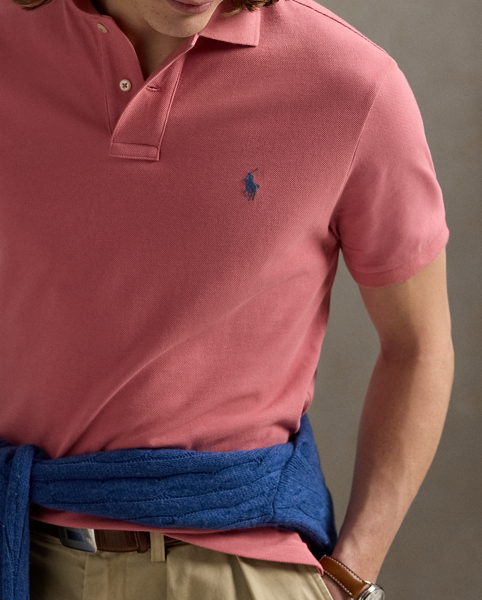 An American style standard since 1972, the Polo shirt has been imitated but never matched. Over the decades, Ralph Lauren Lauren has re-imagined his signature style in a wide array of colours and fits, yet all retain the quality and attention to detail of the iconic original. This trim version is made from our highly breathable cotton mesh, which offers a textured look and a soft feel.