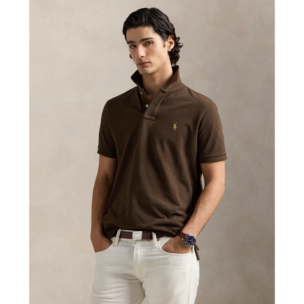 An American style standard since 1972, the Polo shirt has been imitated but never matched. Over the decades, Ralph Lauren Lauren has re-imagined his signature style in a wide array of colours and fits, yet all retain the quality and attention to detail of the iconic original. This trim version is made from our highly breathable cotton mesh, which offers a textured look and a soft feel.