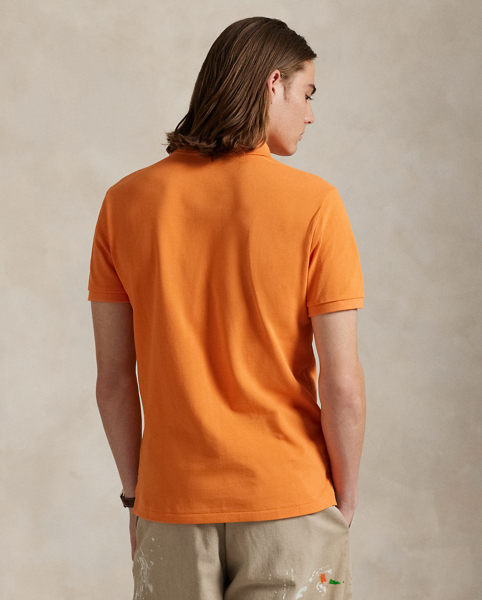 An American style standard since 1972, the Polo shirt has been imitated but never matched. Over the decades, Ralph Lauren Lauren has re-imagined his signature style in a wide array of colours and fits, yet all retain the quality and attention to detail of the iconic original. This trim version is made from our highly breathable cotton mesh, which offers a textured look and a soft feel.