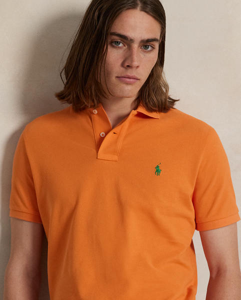 An American style standard since 1972, the Polo shirt has been imitated but never matched. Over the decades, Ralph Lauren Lauren has re-imagined his signature style in a wide array of colours and fits, yet all retain the quality and attention to detail of the iconic original. This trim version is made from our highly breathable cotton mesh, which offers a textured look and a soft feel.