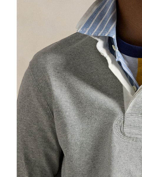 With its athletic details and timeless design, The Iconic Rugby Shirt captures the preppy yet sporty sensibility that has long defined the Polo  Ralph Lauren Lauren brand. This version features all the hallmarks of a traditional rugby shirt – the white point collar, concealed placket, rubber buttons and rib-knit cuffs. Made from durable cotton jersey that stays true to the sport's rough-and-tumble heritage, this shirt will stand up to repeated wear on and off the field of play.