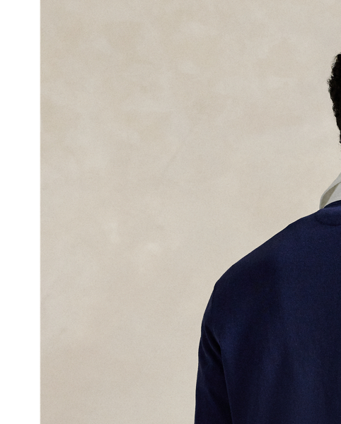 With its athletic details and timeless design, The Iconic Rugby Shirt captures the preppy yet sporty sensibility that has long defined the Polo  Ralph Lauren Lauren brand. This version features all the hallmarks of a traditional rugby shirt – the white point collar, concealed placket, rubber buttons and rib-knit cuffs. Made from durable cotton jersey that stays true to the sport's rough-and-tumble heritage, this shirt will stand up to repeated wear on and off the field of play.