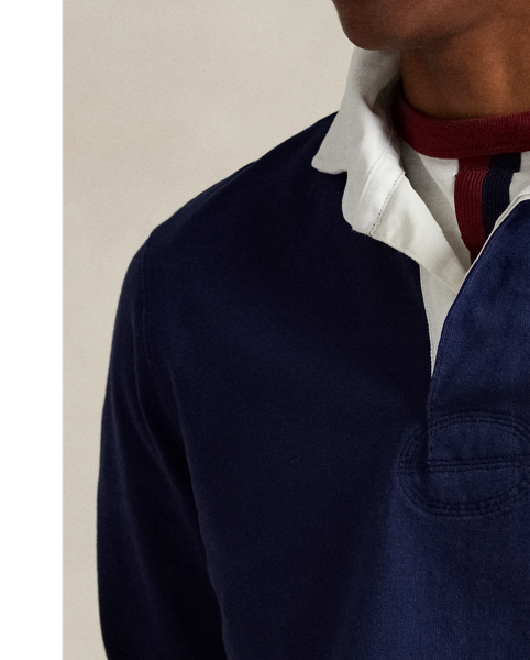 With its athletic details and timeless design, The Iconic Rugby Shirt captures the preppy yet sporty sensibility that has long defined the Polo  Ralph Lauren Lauren brand. This version features all the hallmarks of a traditional rugby shirt – the white point collar, concealed placket, rubber buttons and rib-knit cuffs. Made from durable cotton jersey that stays true to the sport's rough-and-tumble heritage, this shirt will stand up to repeated wear on and off the field of play.