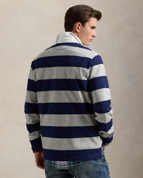 With its athletic details and timeless design, the Iconic Rugby Shirt captures the preppy yet sporty sensibility that has long defined the Polo Ralph Lauren Lauren brand. This version features all the hallmarks of a traditional rugby shirt – the distinctive stripe, white point collar, concealed placket, rubber buttons and rib-knit cuffs. Made from durable cotton jersey, which stays true to the sport's rough-and-tumble heritage, this shirt will stand up to repeated wear on and off the pitch.