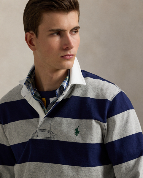 With its athletic details and timeless design, the Iconic Rugby Shirt captures the preppy yet sporty sensibility that has long defined the Polo Ralph Lauren Lauren brand. This version features all the hallmarks of a traditional rugby shirt – the distinctive stripe, white point collar, concealed placket, rubber buttons and rib-knit cuffs. Made from durable cotton jersey, which stays true to the sport's rough-and-tumble heritage, this shirt will stand up to repeated wear on and off the pitch.