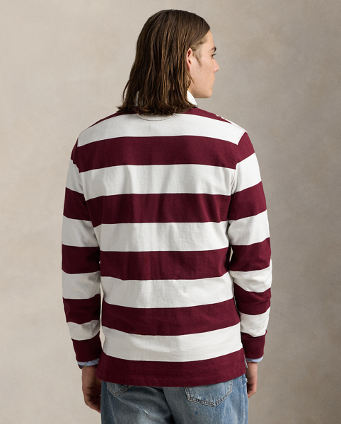 With its athletic details and timeless design, the Iconic Rugby Shirt captures the preppy yet sporty sensibility that has long defined the Polo Ralph Lauren Lauren brand. This version features all the hallmarks of a traditional rugby shirt – the distinctive stripe, white point collar, concealed placket, rubber buttons and rib-knit cuffs. Made from durable cotton jersey, which stays true to the sport's rough-and-tumble heritage, this shirt will stand up to repeated wear on and off the pitch.