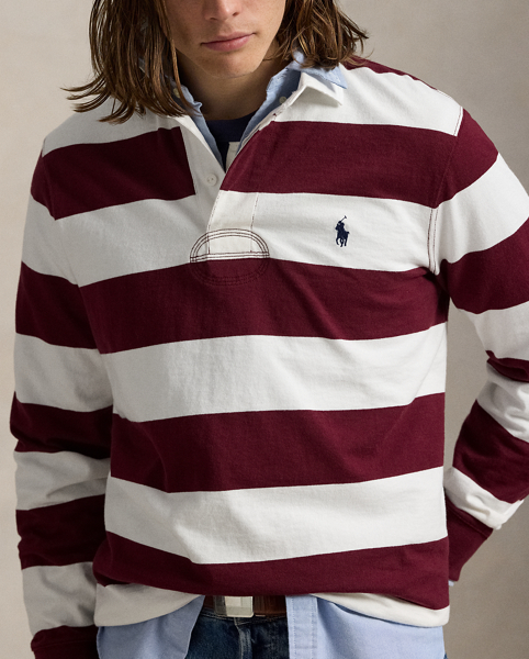 With its athletic details and timeless design, the Iconic Rugby Shirt captures the preppy yet sporty sensibility that has long defined the Polo Ralph Lauren Lauren brand. This version features all the hallmarks of a traditional rugby shirt – the distinctive stripe, white point collar, concealed placket, rubber buttons and rib-knit cuffs. Made from durable cotton jersey, which stays true to the sport's rough-and-tumble heritage, this shirt will stand up to repeated wear on and off the pitch.