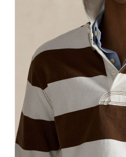 With its athletic details and timeless design, the Iconic Rugby Shirt captures the preppy yet sporty sensibility that has long defined the Polo  Ralph Lauren Lauren brand. This version features all the hallmarks of a traditional rugby shirt – the distinctive stripe, white point collar, concealed placket, rubber buttons and rib-knit cuffs. Made from durable cotton jersey, which stays true to the sport's rough-and-tumble heritage, this shirt will stand up to repeated wear on and off the pitch.