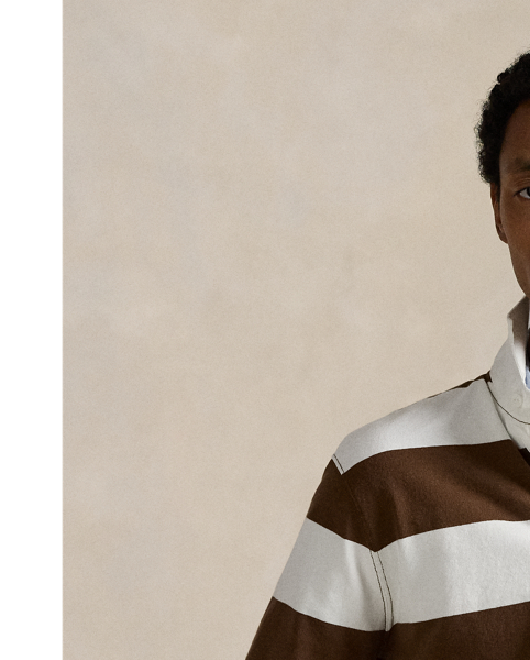 With its athletic details and timeless design, the Iconic Rugby Shirt captures the preppy yet sporty sensibility that has long defined the Polo  Ralph Lauren Lauren brand. This version features all the hallmarks of a traditional rugby shirt – the distinctive stripe, white point collar, concealed placket, rubber buttons and rib-knit cuffs. Made from durable cotton jersey, which stays true to the sport's rough-and-tumble heritage, this shirt will stand up to repeated wear on and off the pitch.